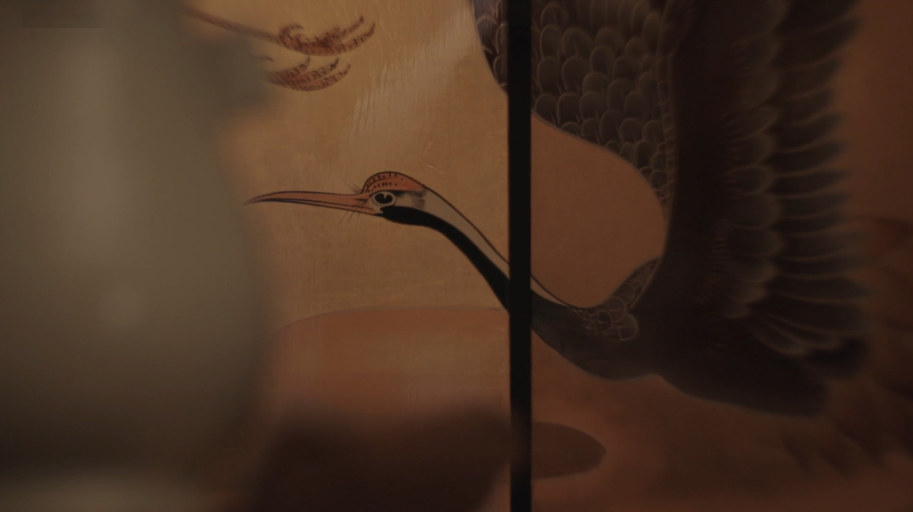 A still from the documentary “On Healing Land, Birds Perch” of a painting of a bird flapping its wings.
